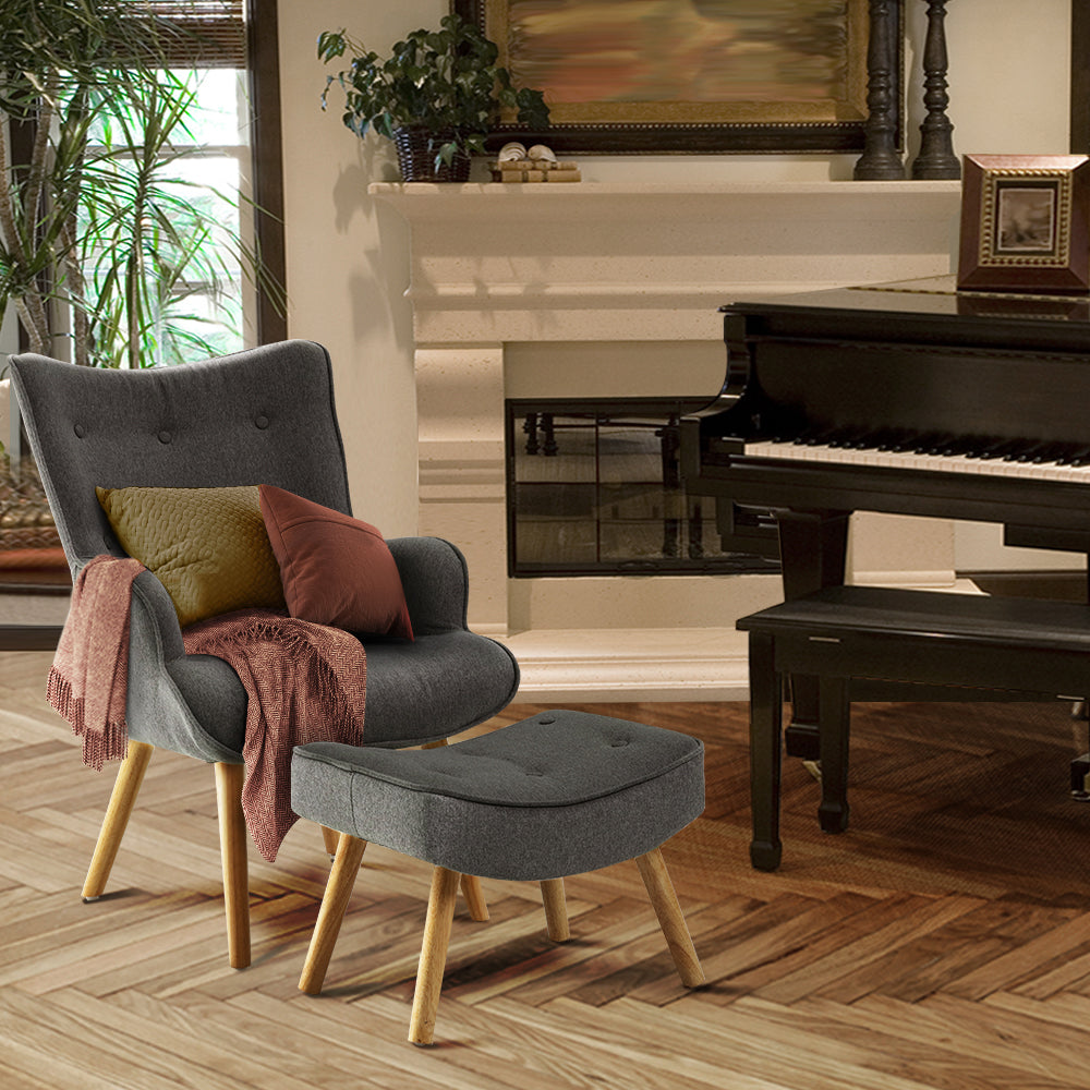 grey armchair and ottoman beside piano