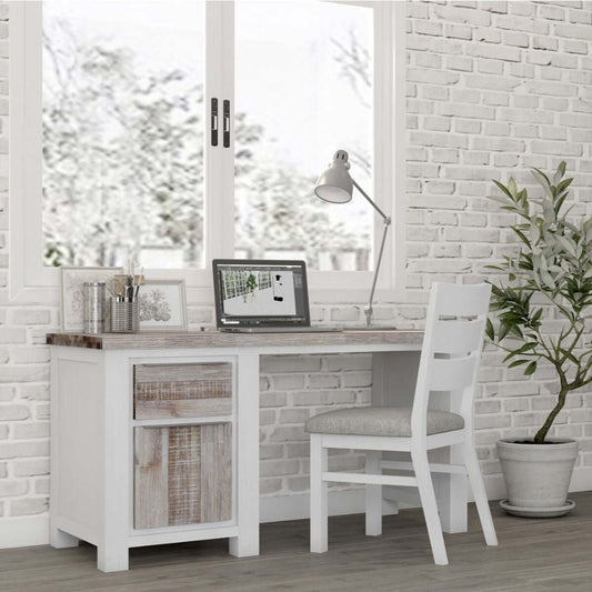 white and wooden desk in room with white brick relief wall and white bookcase with plant